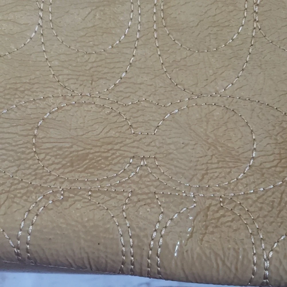 Coach Soho tan stitched satchel with buckle front accent